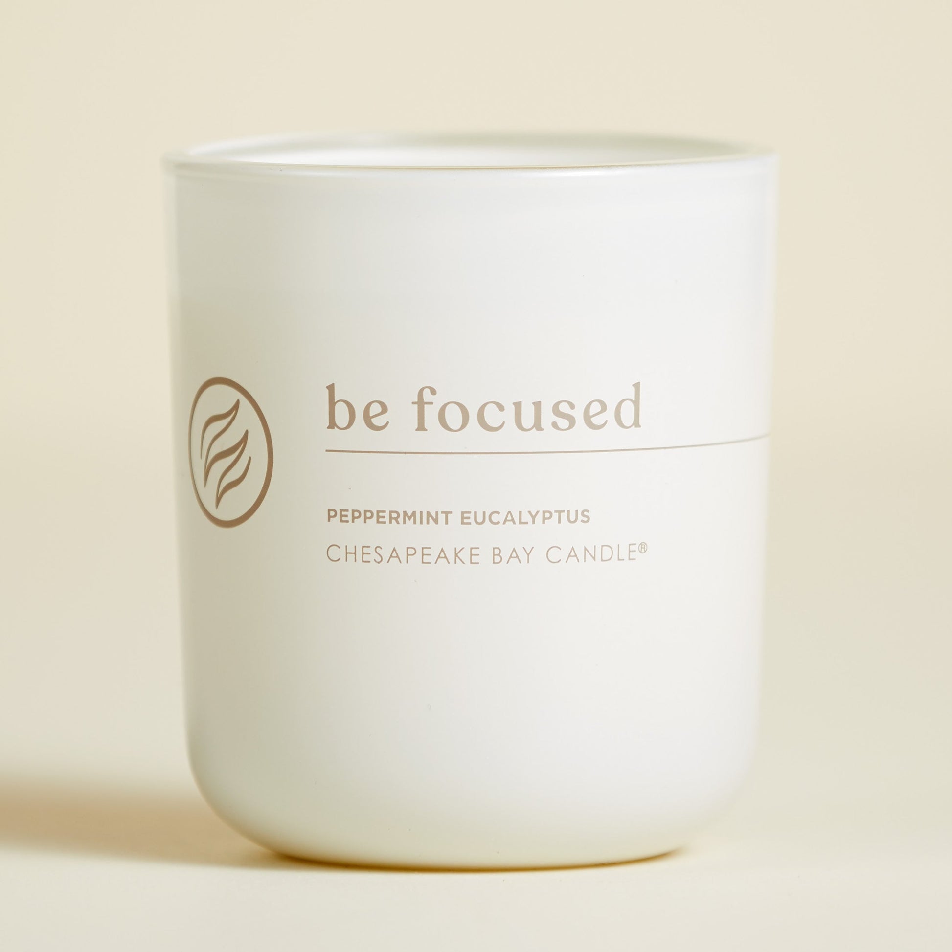 chesapeake bay candle intentions collection be focused peppermint eucalyptus medium two wick candle in a pastel yellow backdrop